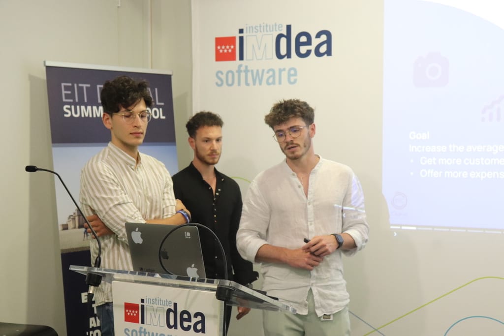 Julien and two students during a project presentation